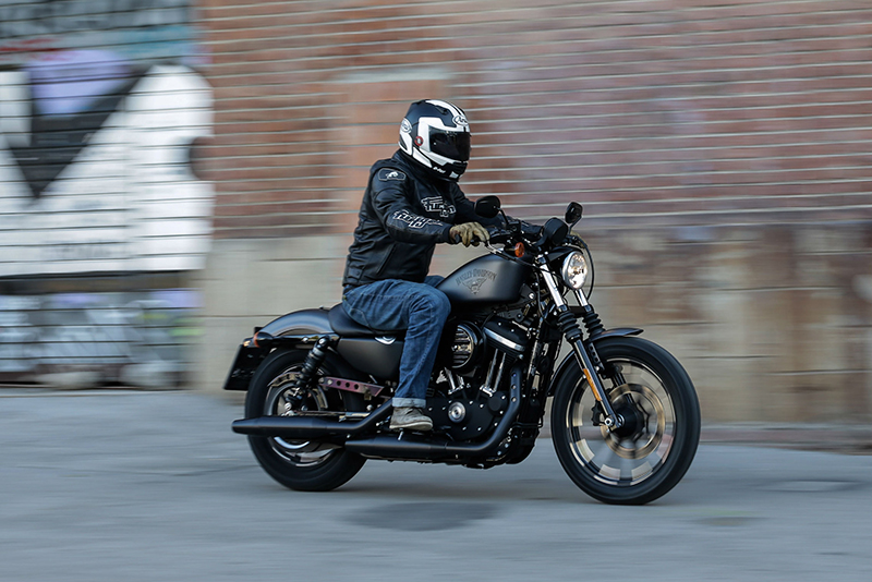 Person riding a Harley-Davidson Sportster 883 Iron